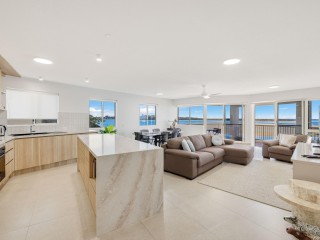ELEVATED COASTAL LIVING WITH SWEEPING WATER & CBD VIEWS