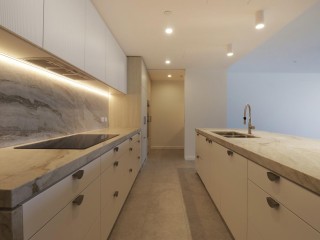 ABSOLUTE WATERFRONT LUXURY - NORTH FACING WITH TWO-CAR ACCOMMODATION
