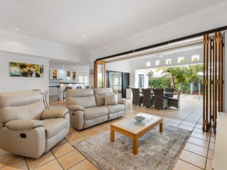 POOLSIDE LIVING MEETS LOWSET COMFORT IN PELICAN WATERS